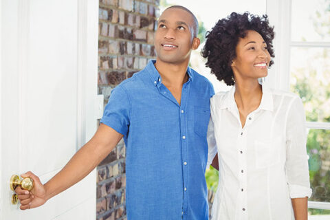 Couple entering the new house