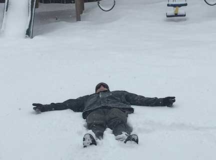 Man lying on the snow